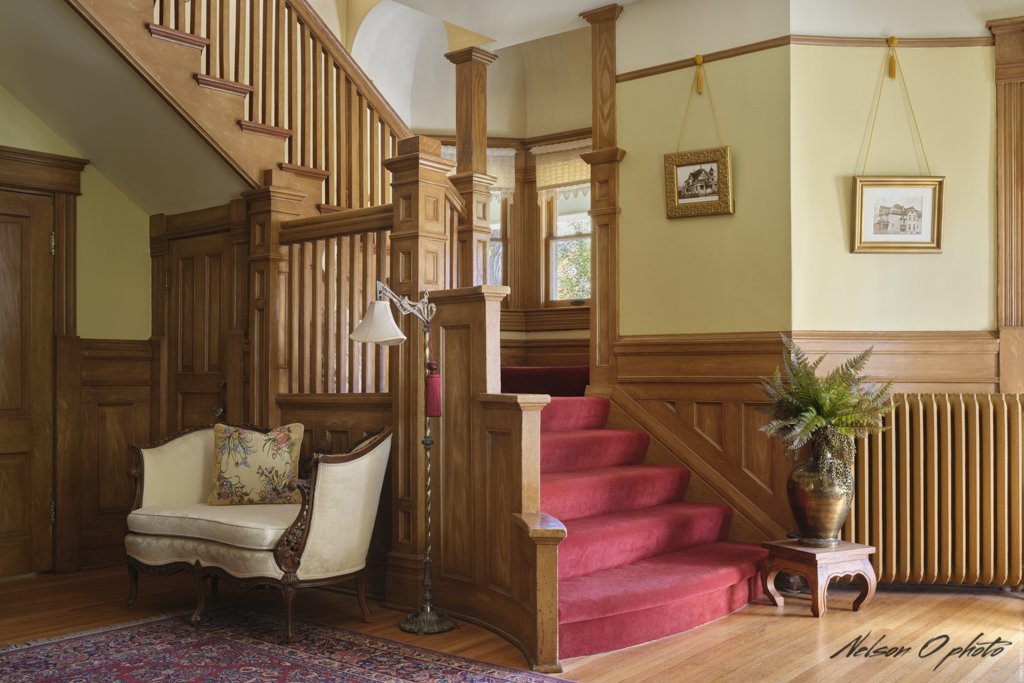 Entry hall staircase and antique settee